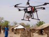 Drone Delivering Aid in African Village