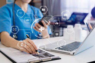 Doctor works with mobile devices on the Internet in the office