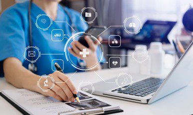 Doctor works with mobile devices on the Internet in the office