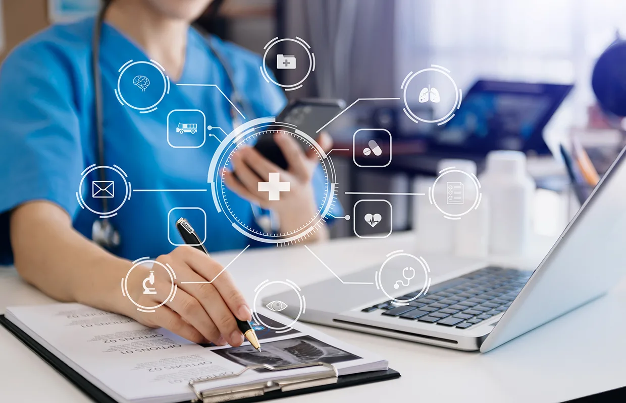 Doctor works with mobile devices on the Internet in the office