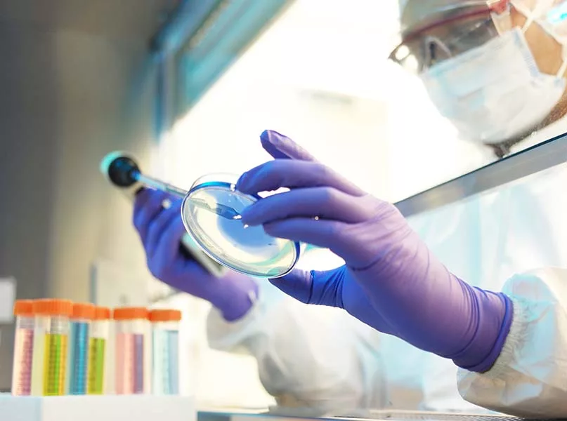 Scientist in clean room laboratory